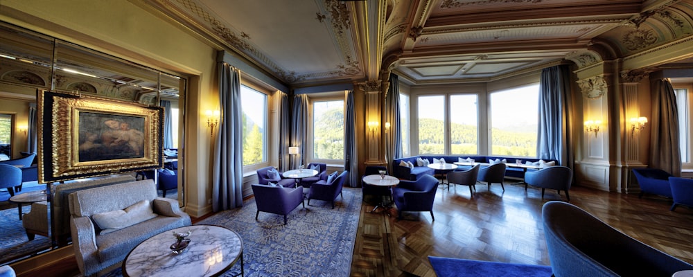 a room with a large chandelier and a large window