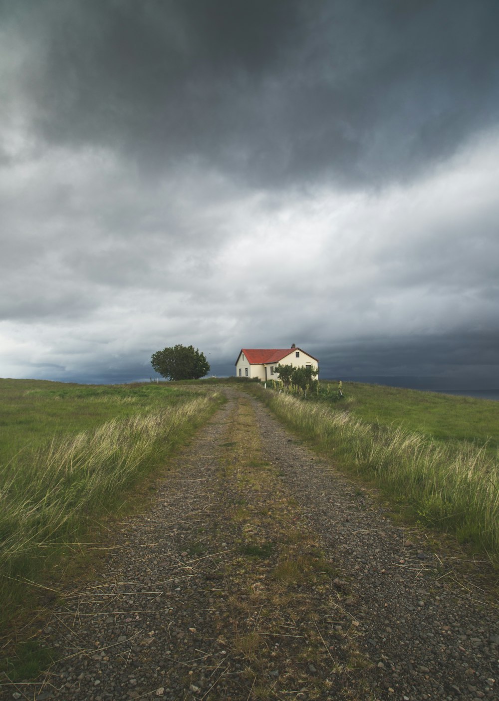 a house on a dirt road