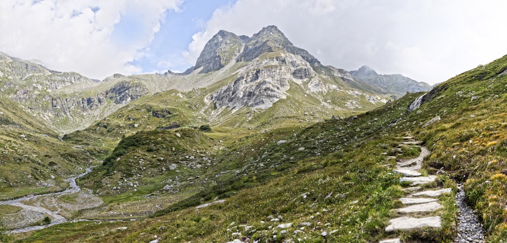 a mountain with a stream running through it