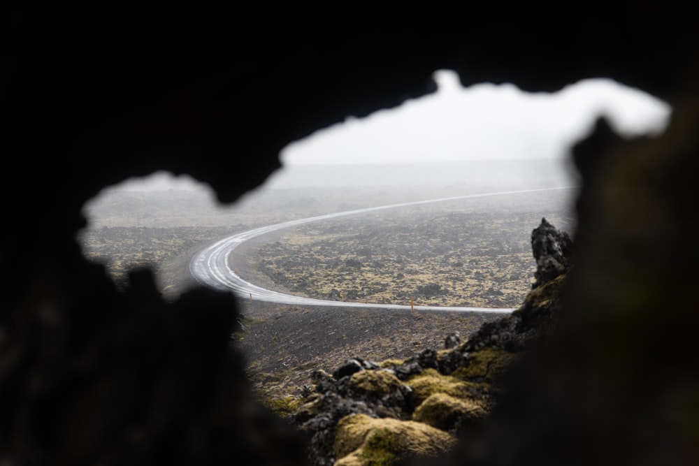 a view of a mountain from a cave