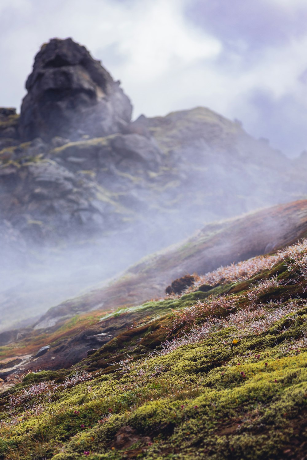 a mountain with clouds