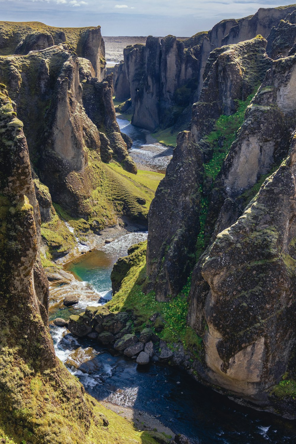 a river running between rocky cliffs
