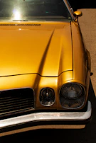 A classic vintage car shining under the sun, evoking nostalgia and style.