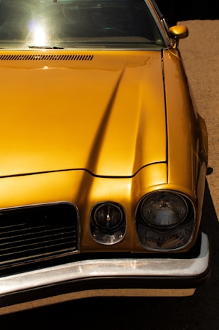 A classic vintage car displayed at an auto show.