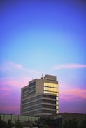 Modern office building with Windmolen Investments logo at sunset