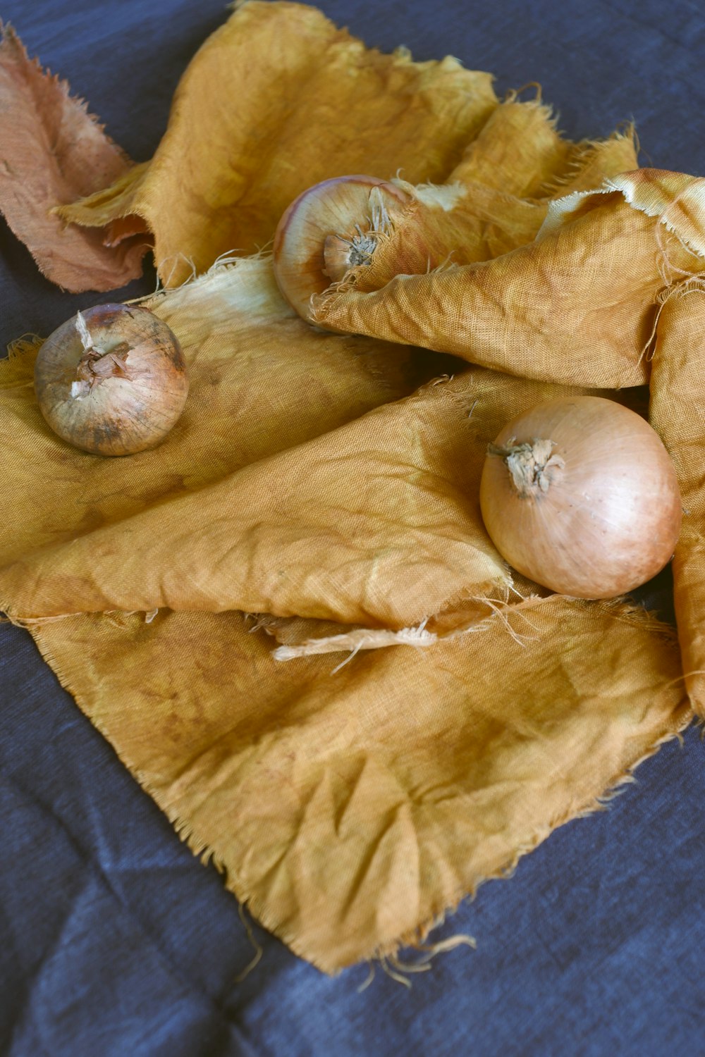 a close-up of a hand with a few onions