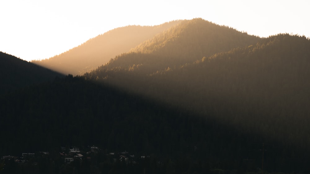 a mountain with a foggy sky