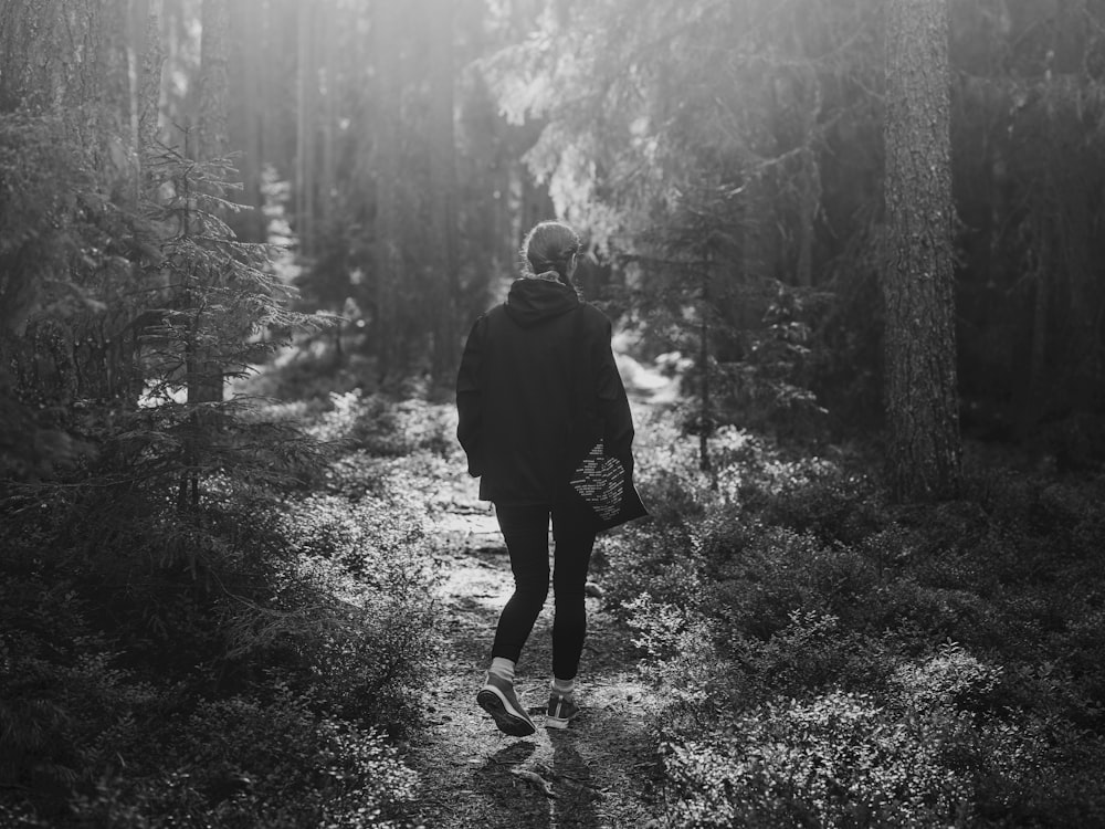 a person walking on a path in the woods