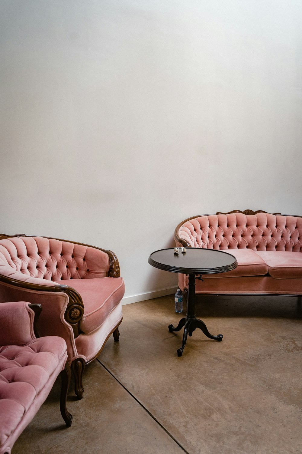 a room with a table chairs and a coffee table