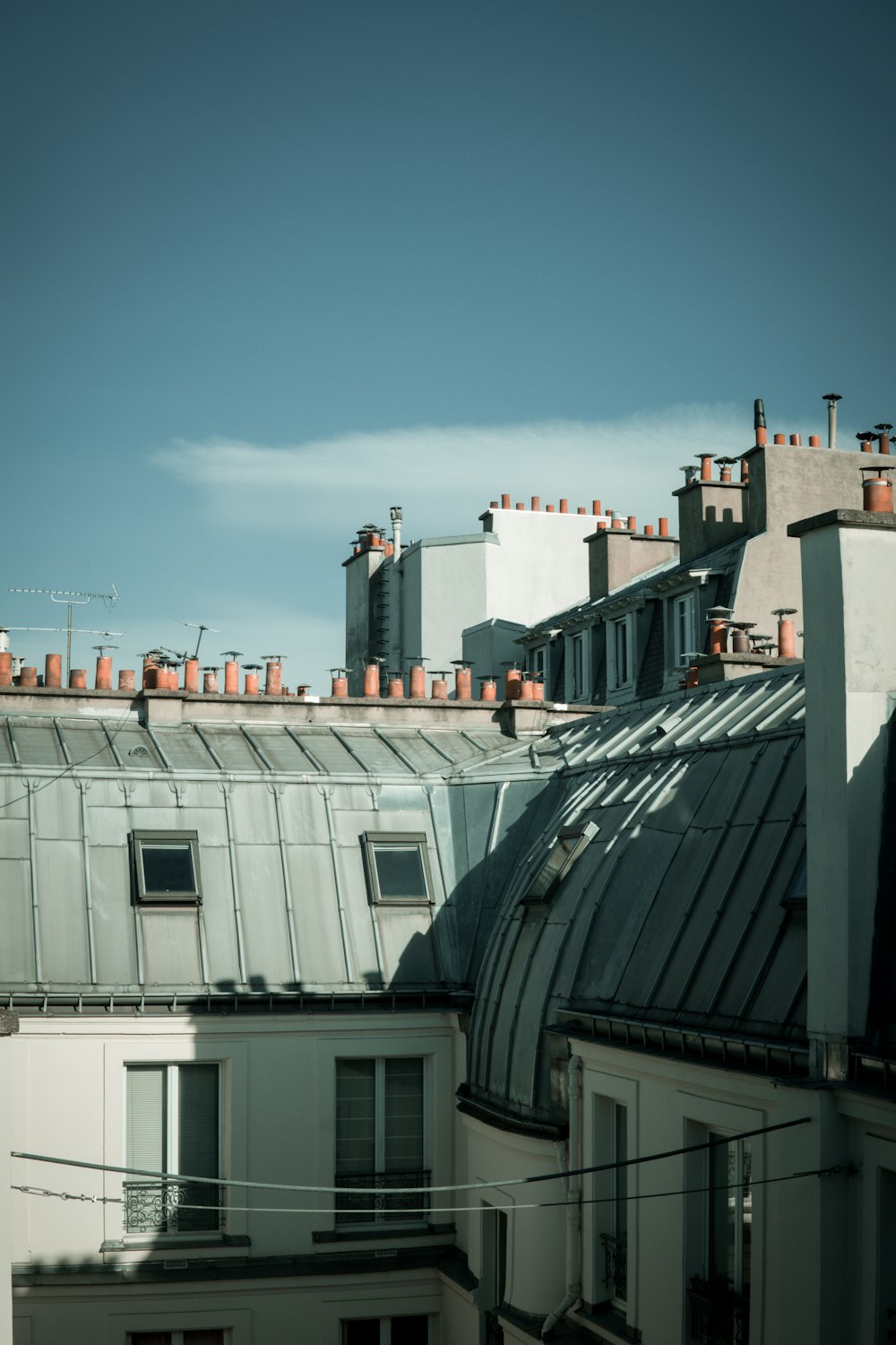 a group of buildings with a blue sky