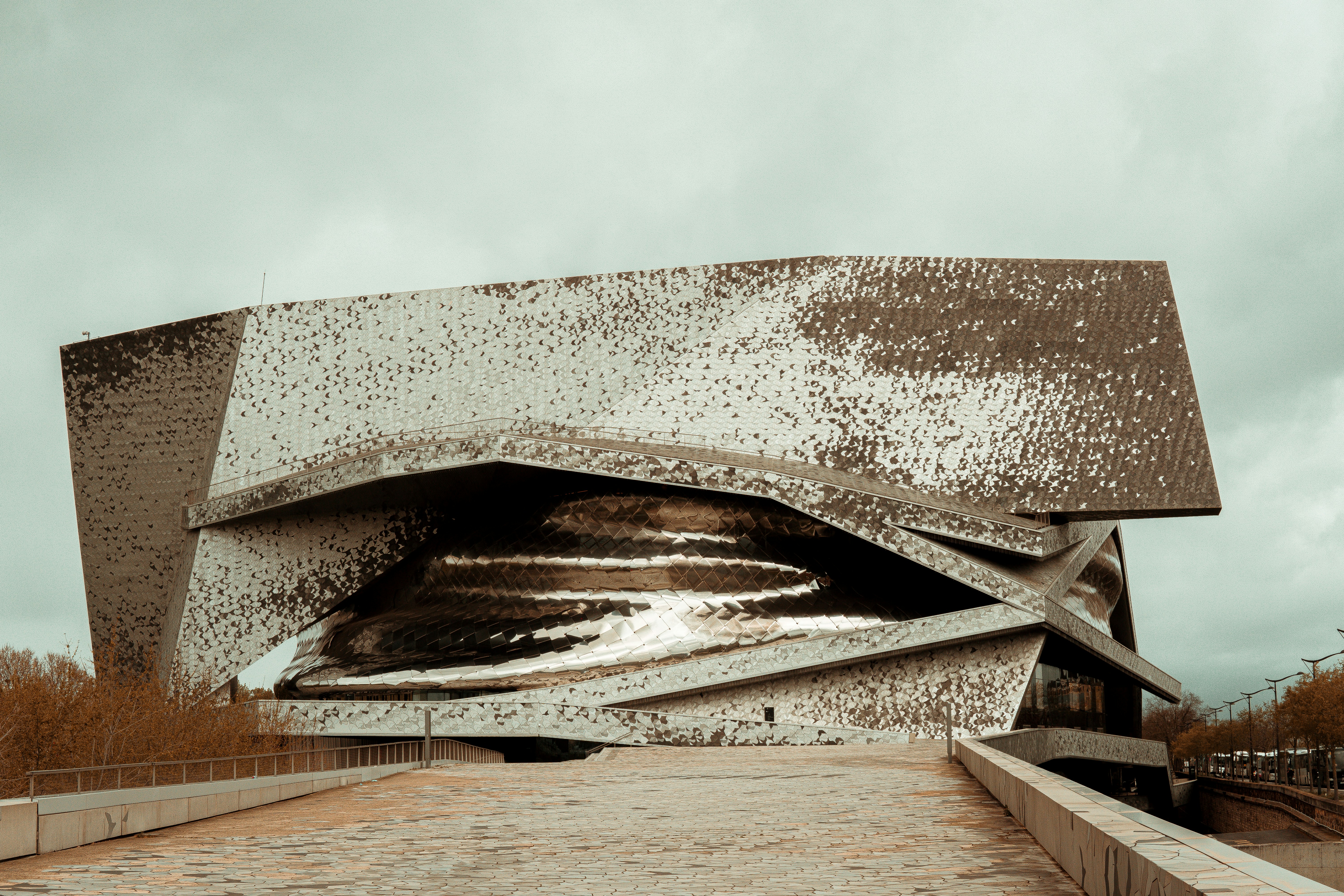 a large stone building with snow on the roof