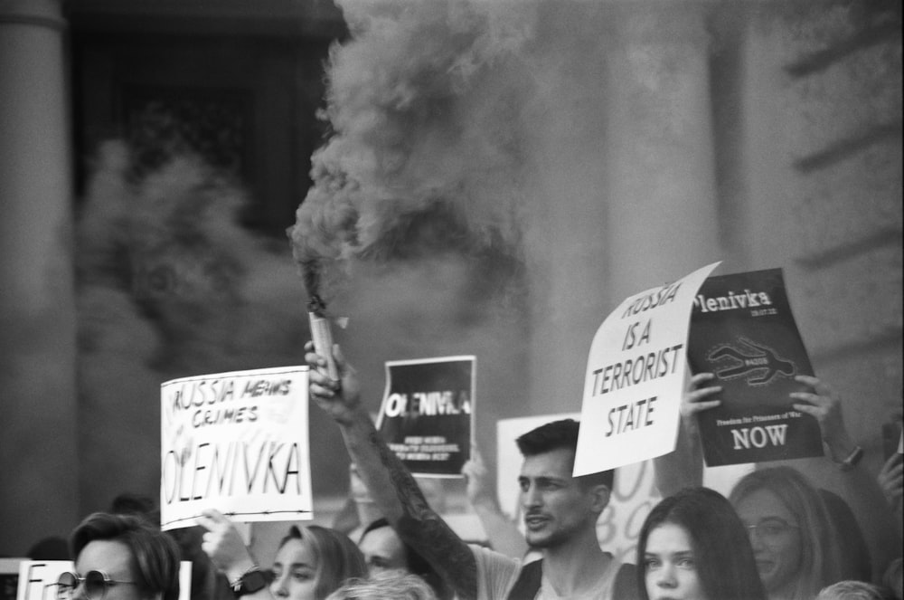 a group of people holding signs