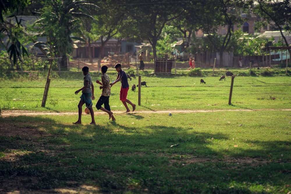 a group of people playing baseball