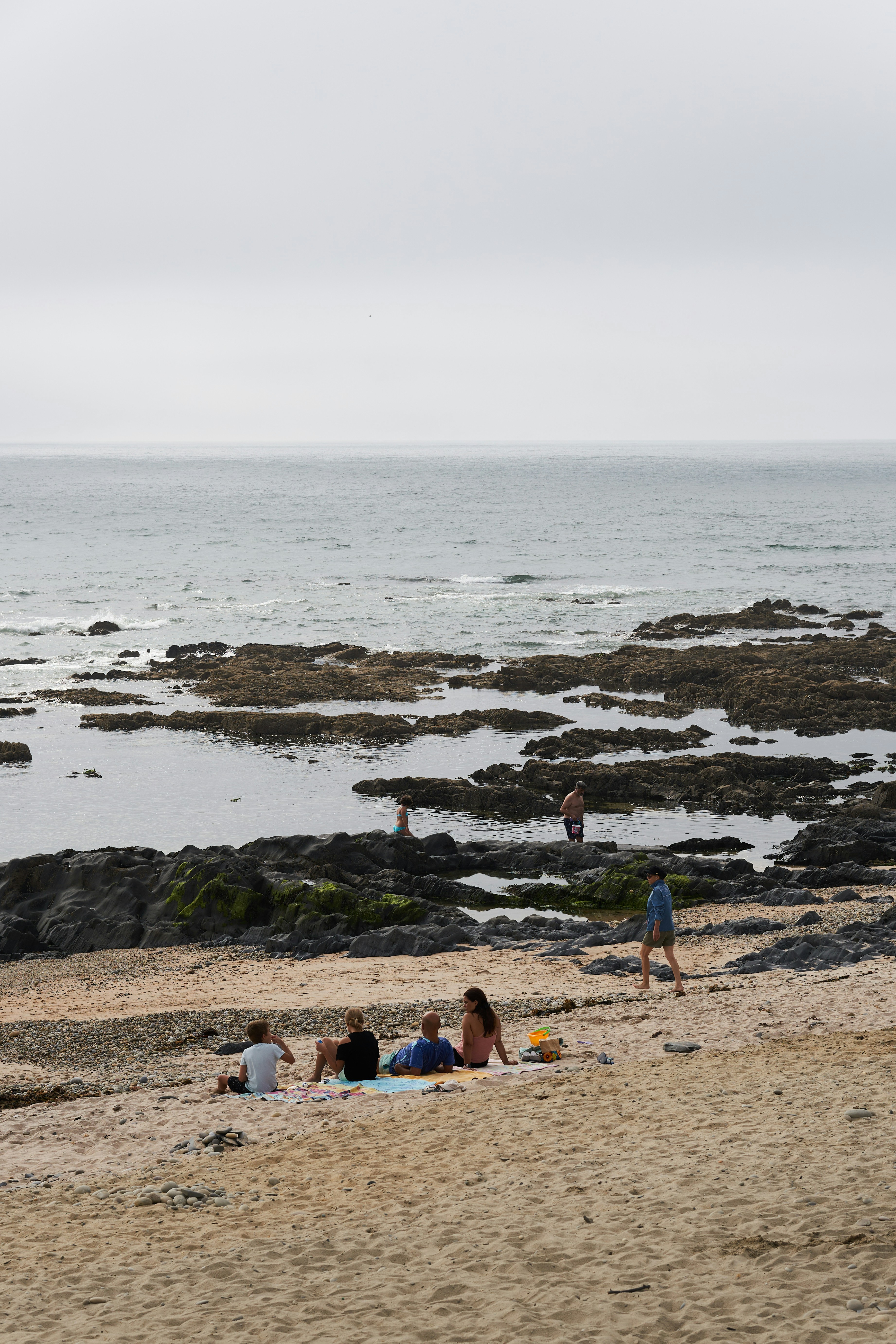 a group of people on a beach