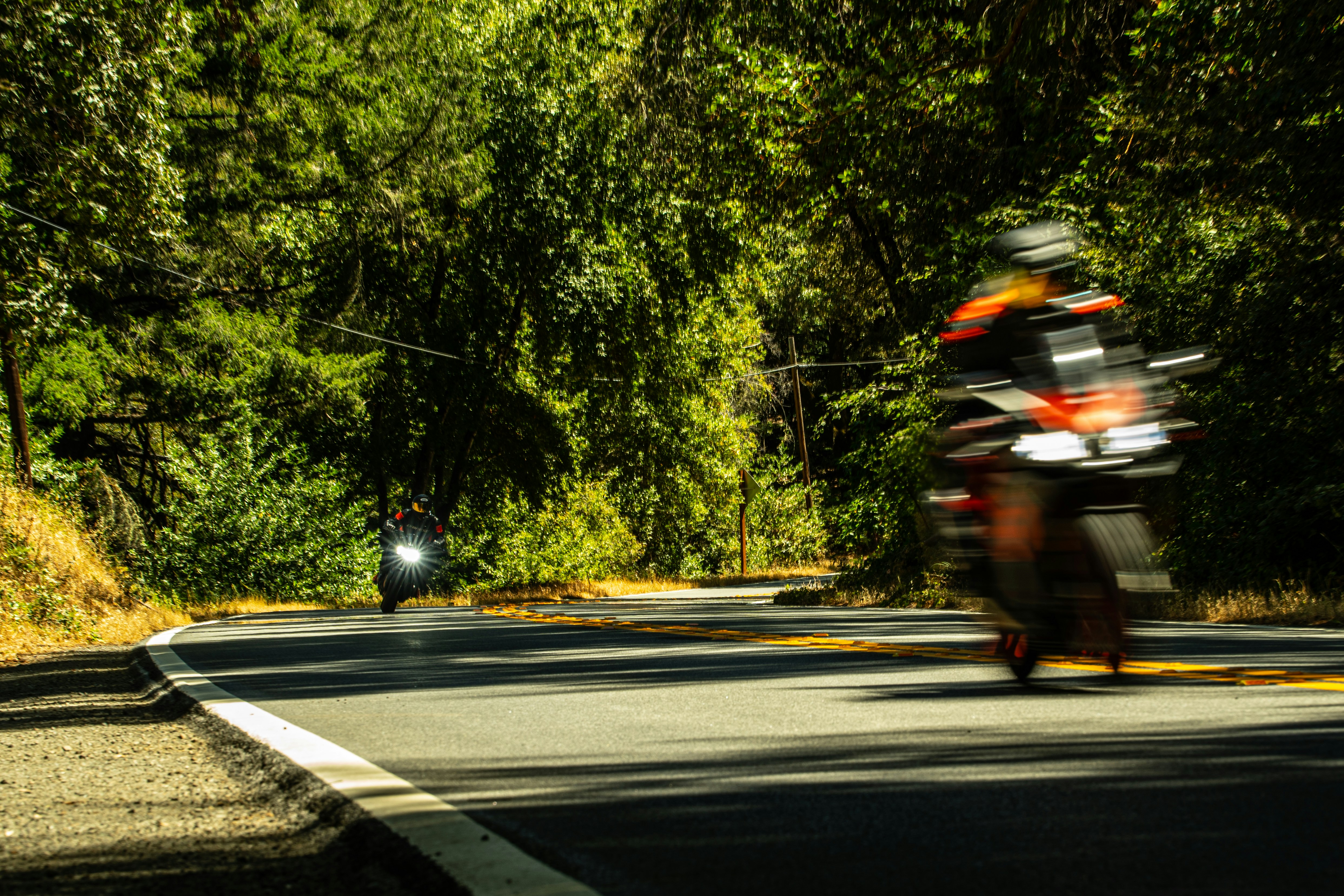 a couple of motorcycles on a road