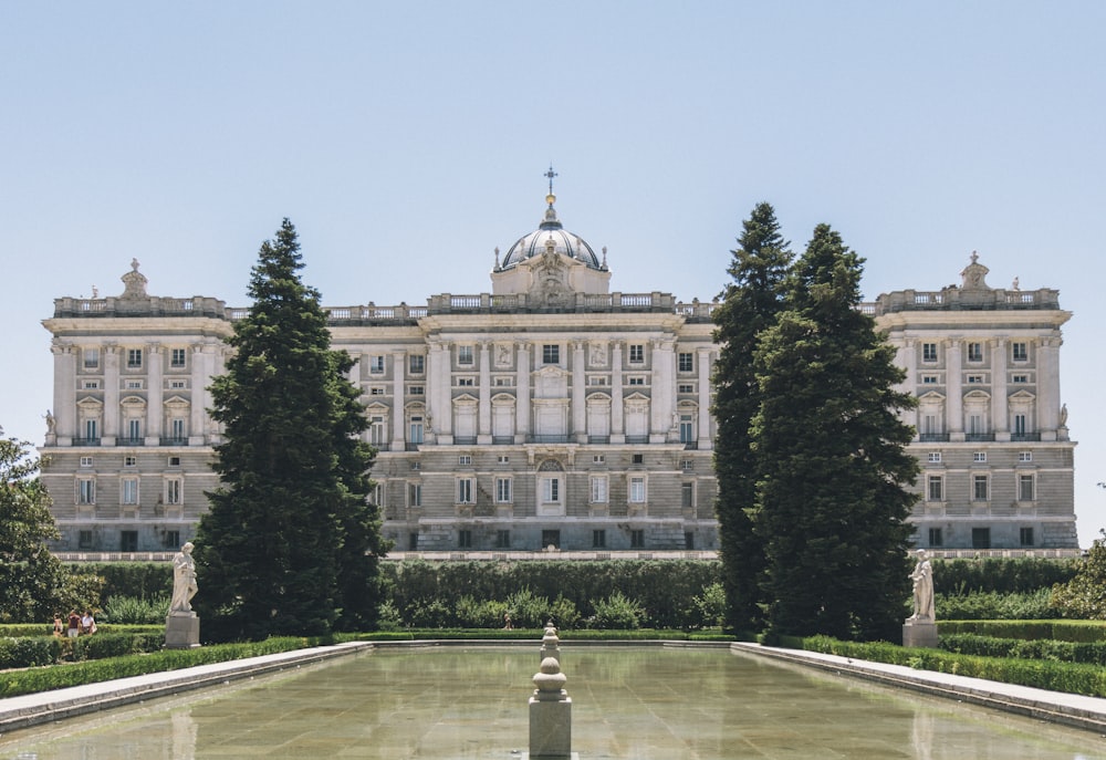 a large building with trees in front of it