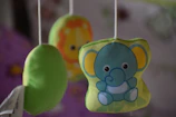 Plush lullaby musical mobile hanging above a crib