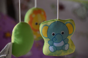 Plush lullaby musical mobile hanging above a crib