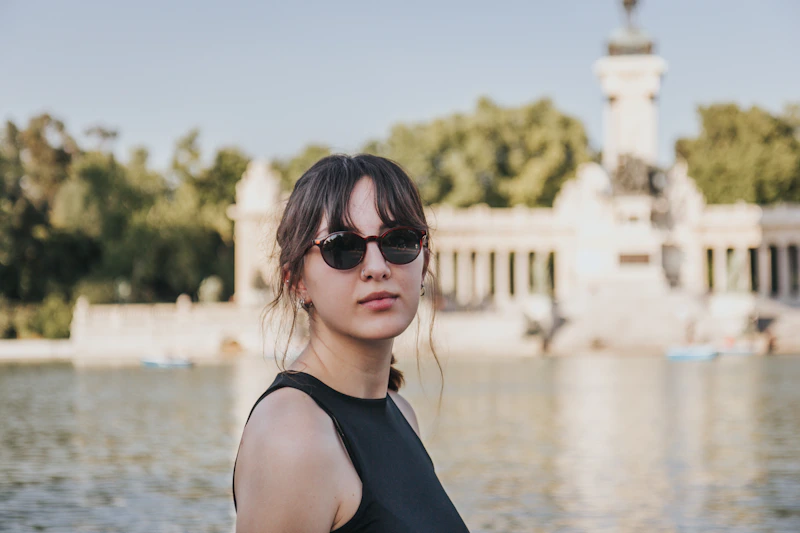 confident woman in sunglasses outdoors