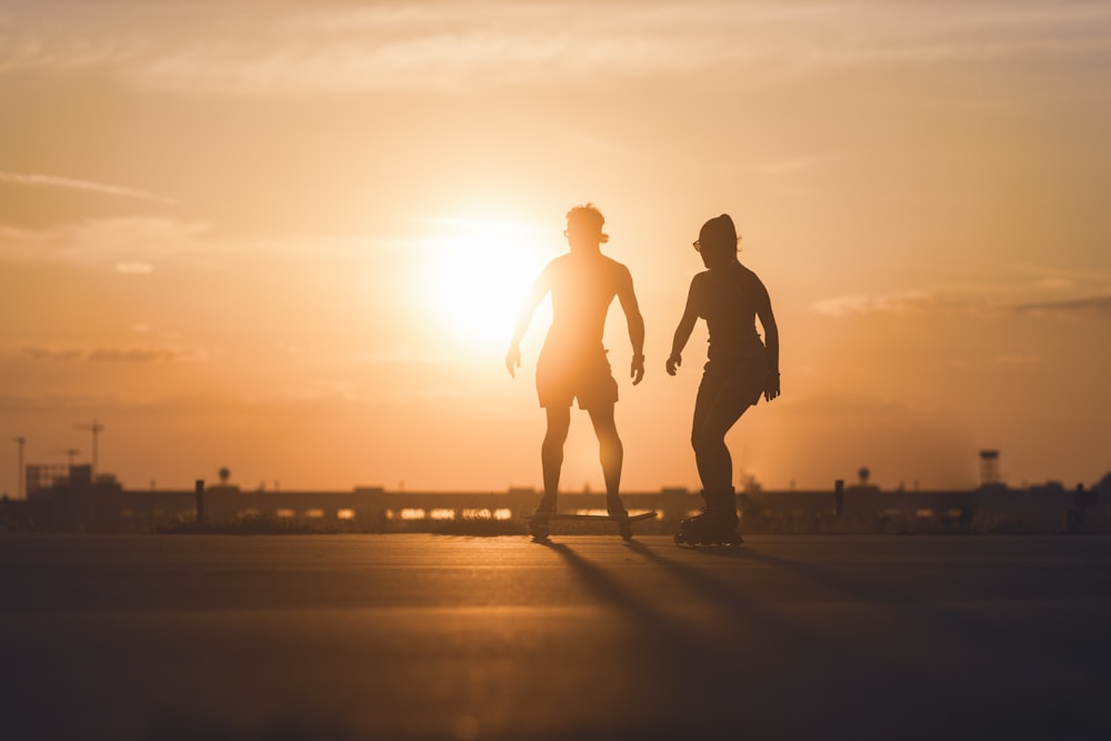 a couple of people skateboarding