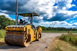 a large yellow vehicle on a road