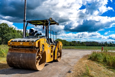 a large yellow vehicle on a road