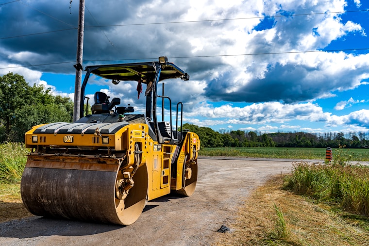 a large yellow vehicle on a road