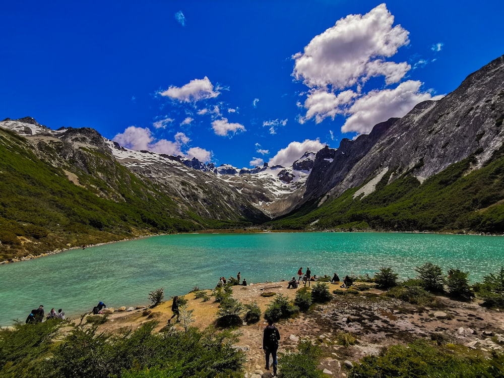 a body of water with mountains around it