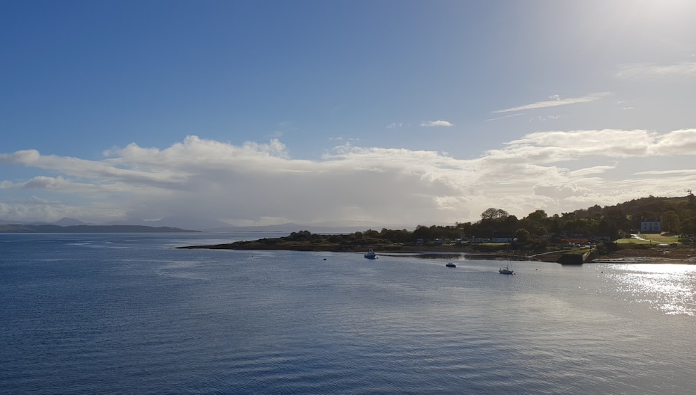 a body of water with land in the distance