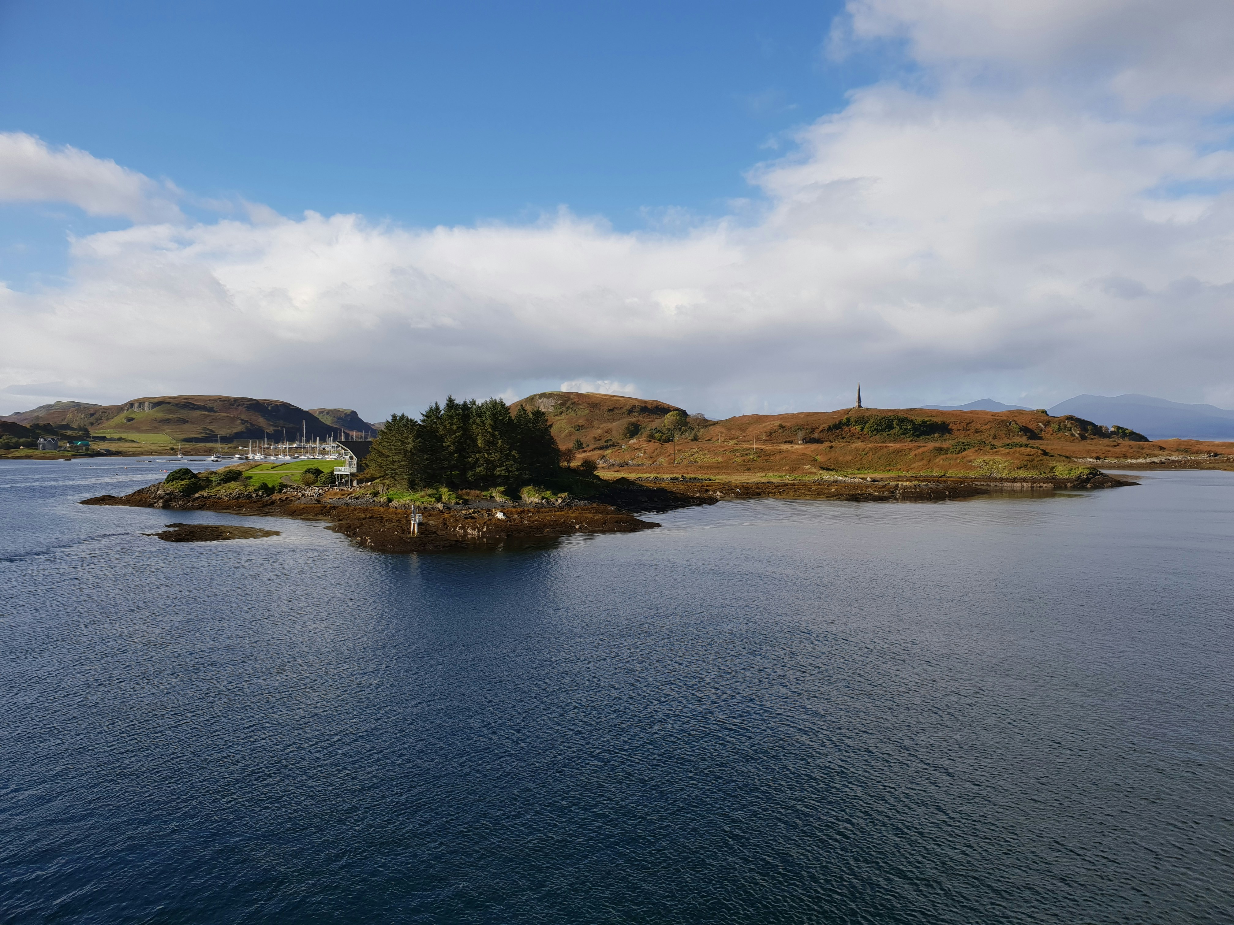 a body of water with land in the back