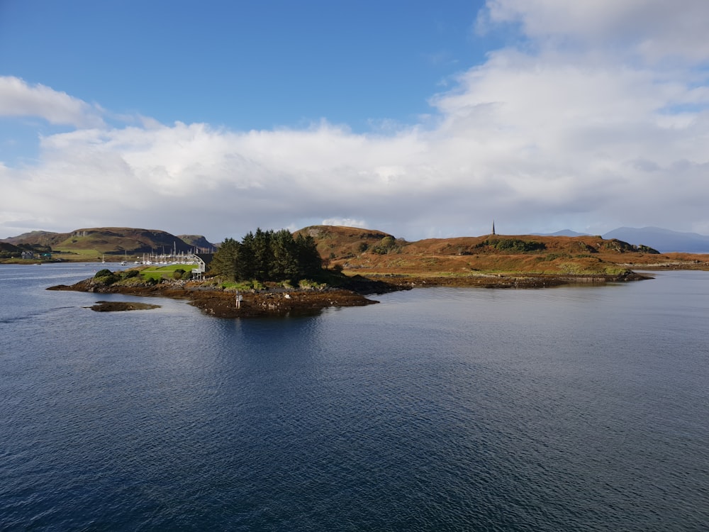 a body of water with land in the back