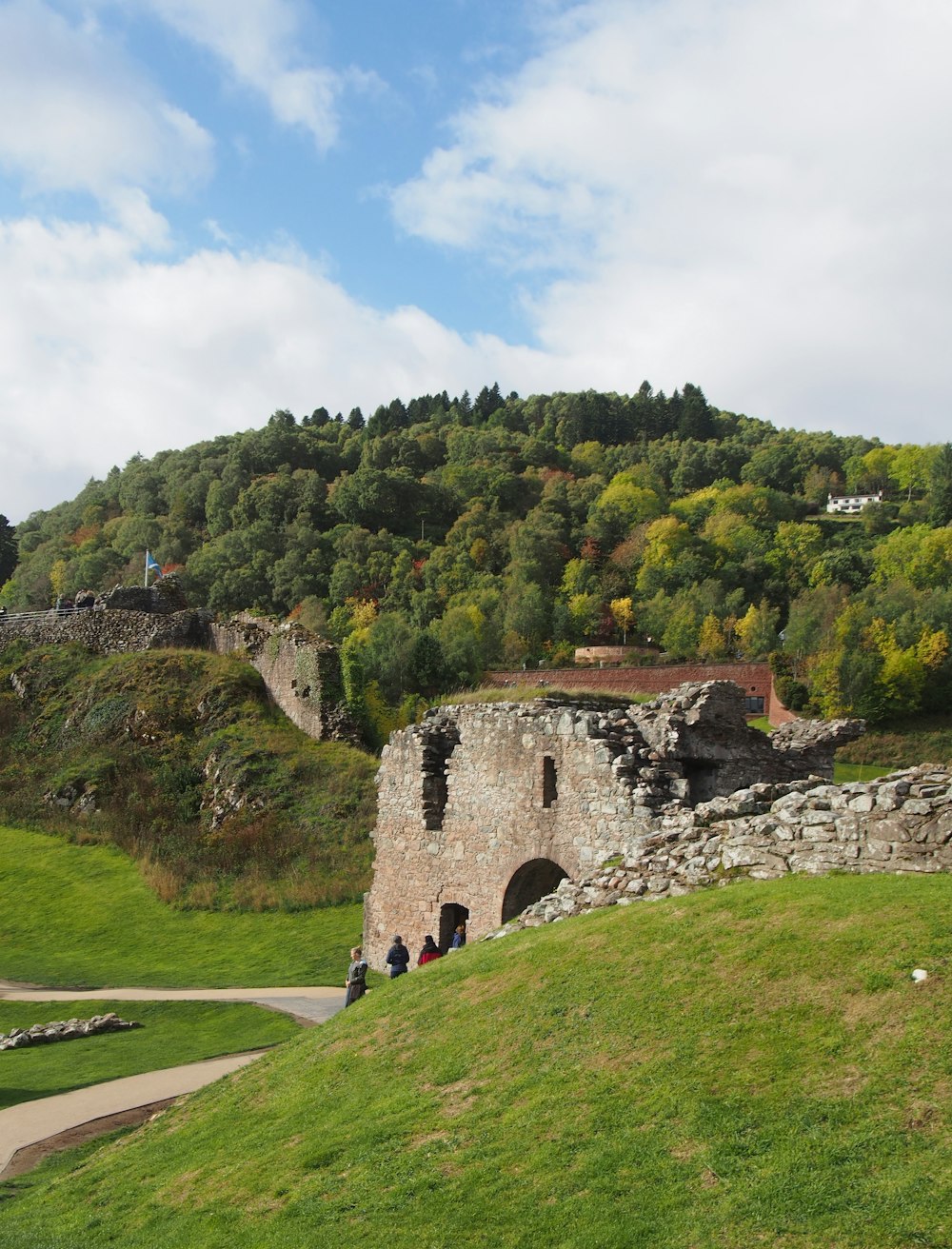 a stone building on a hill