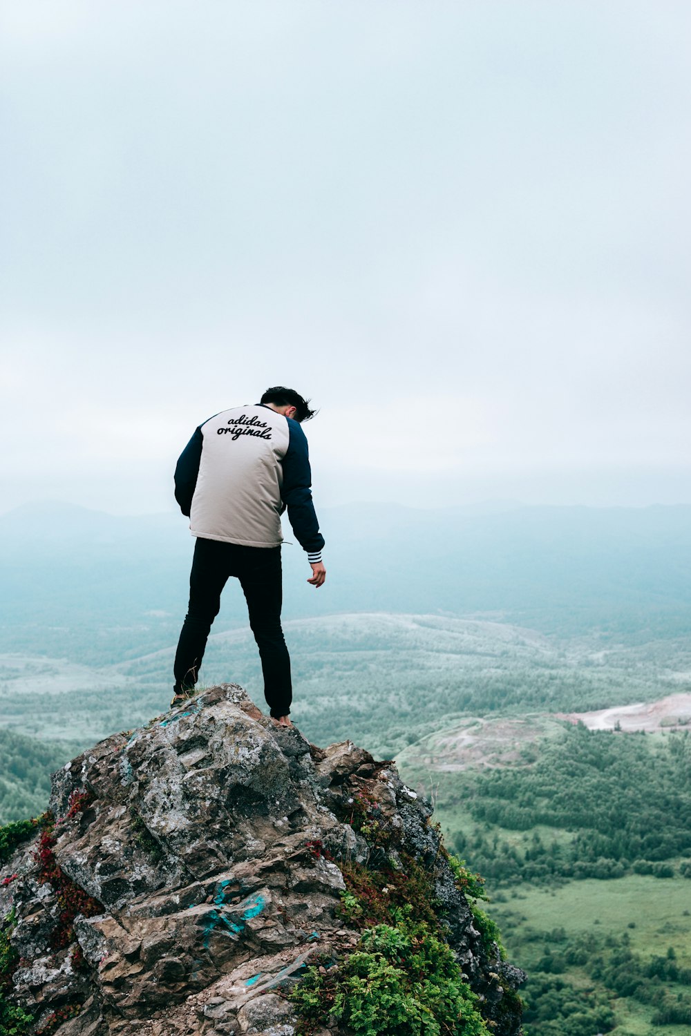 a man standing on a rock