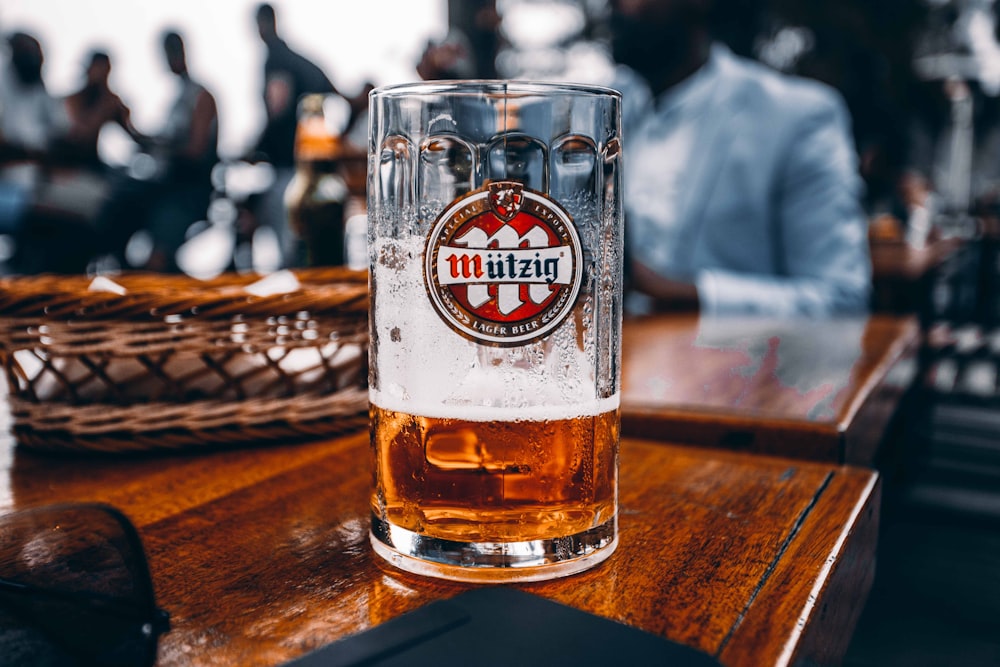 a glass of beer on a table