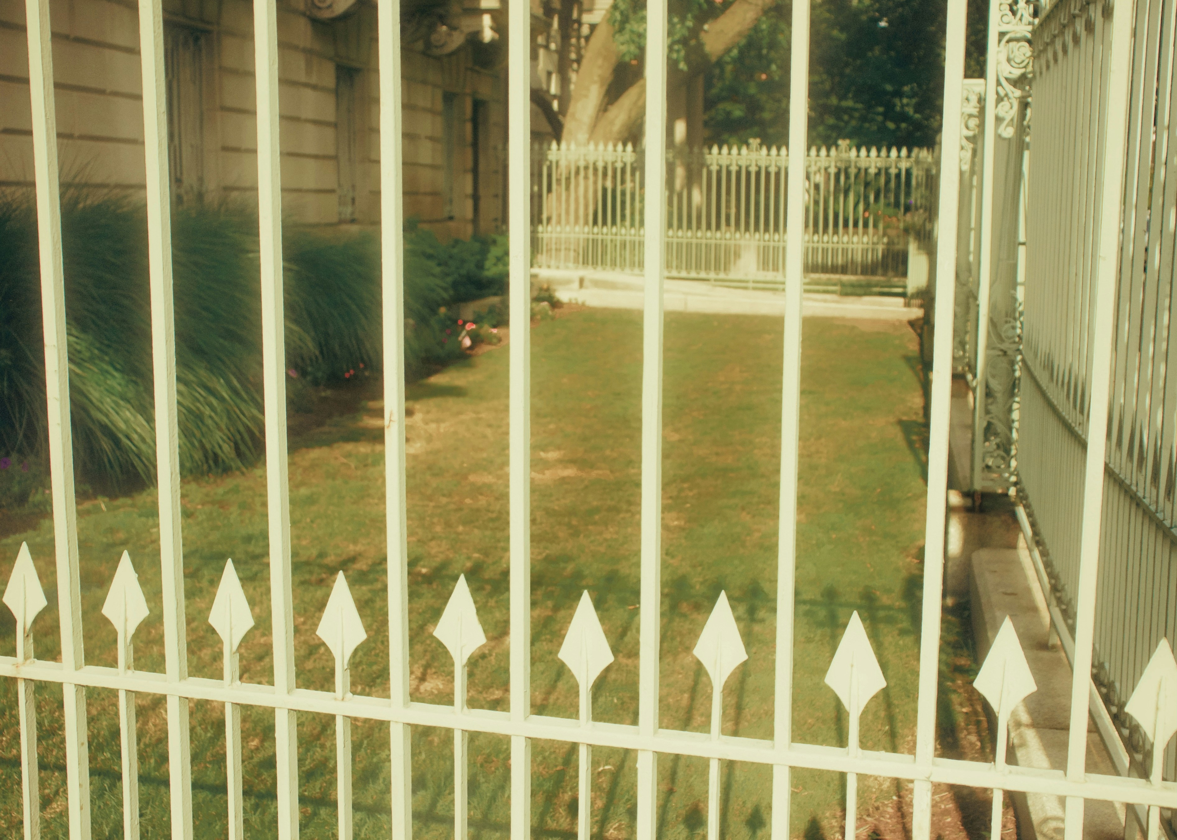 a white fence with white picket fence