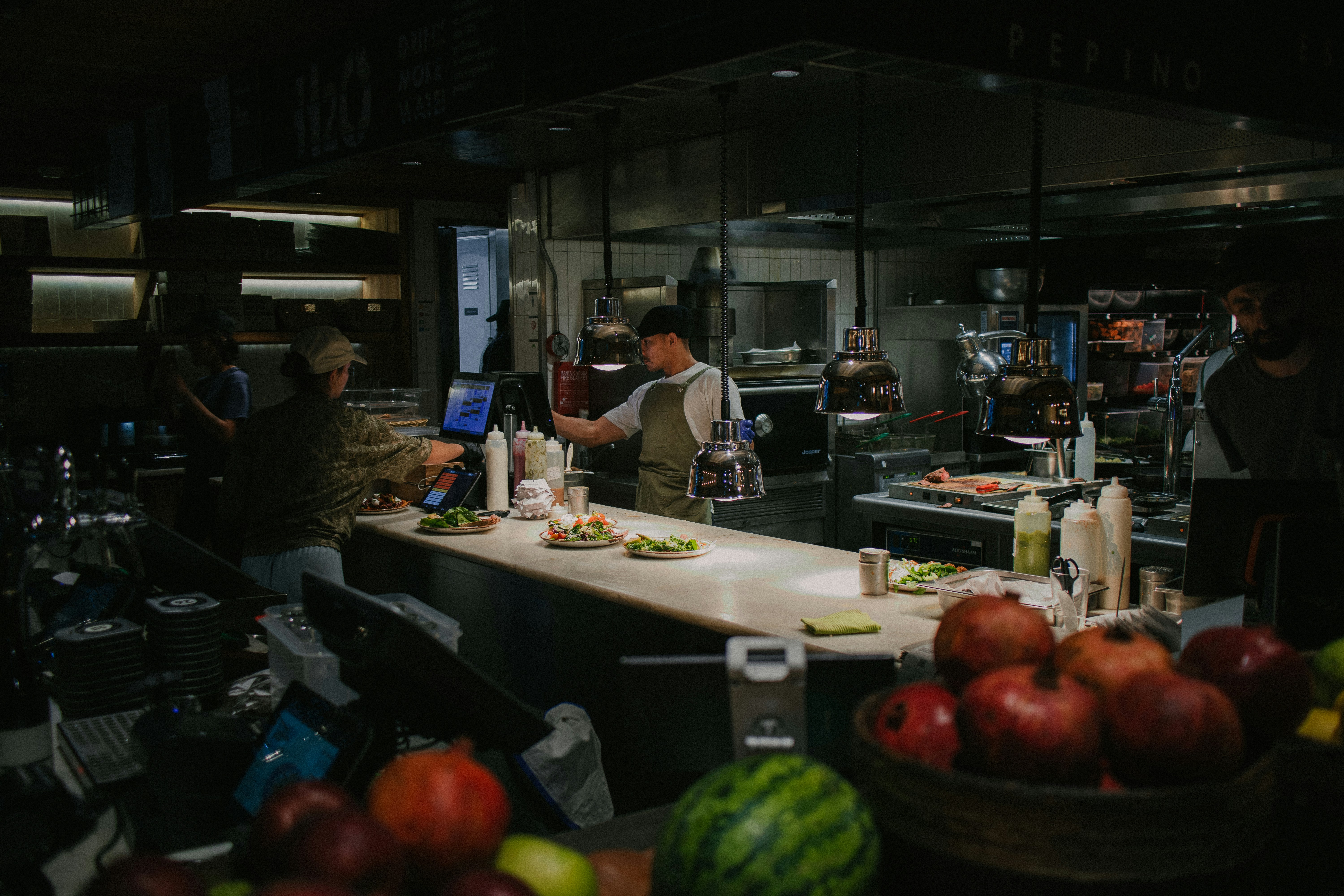 a group of people in a kitchen