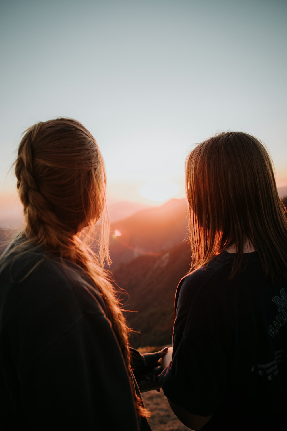 two women looking at the sunset