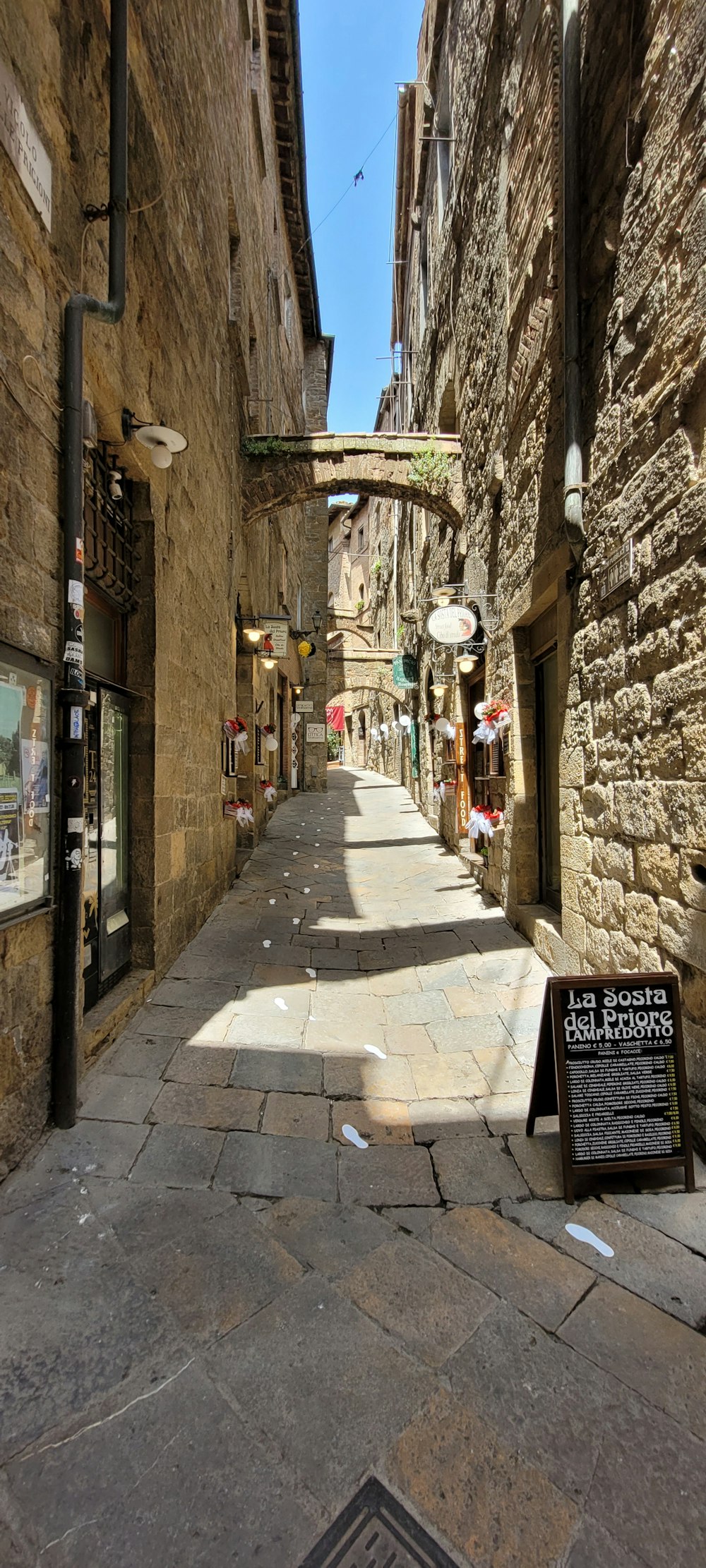 a narrow street with buildings on both sides