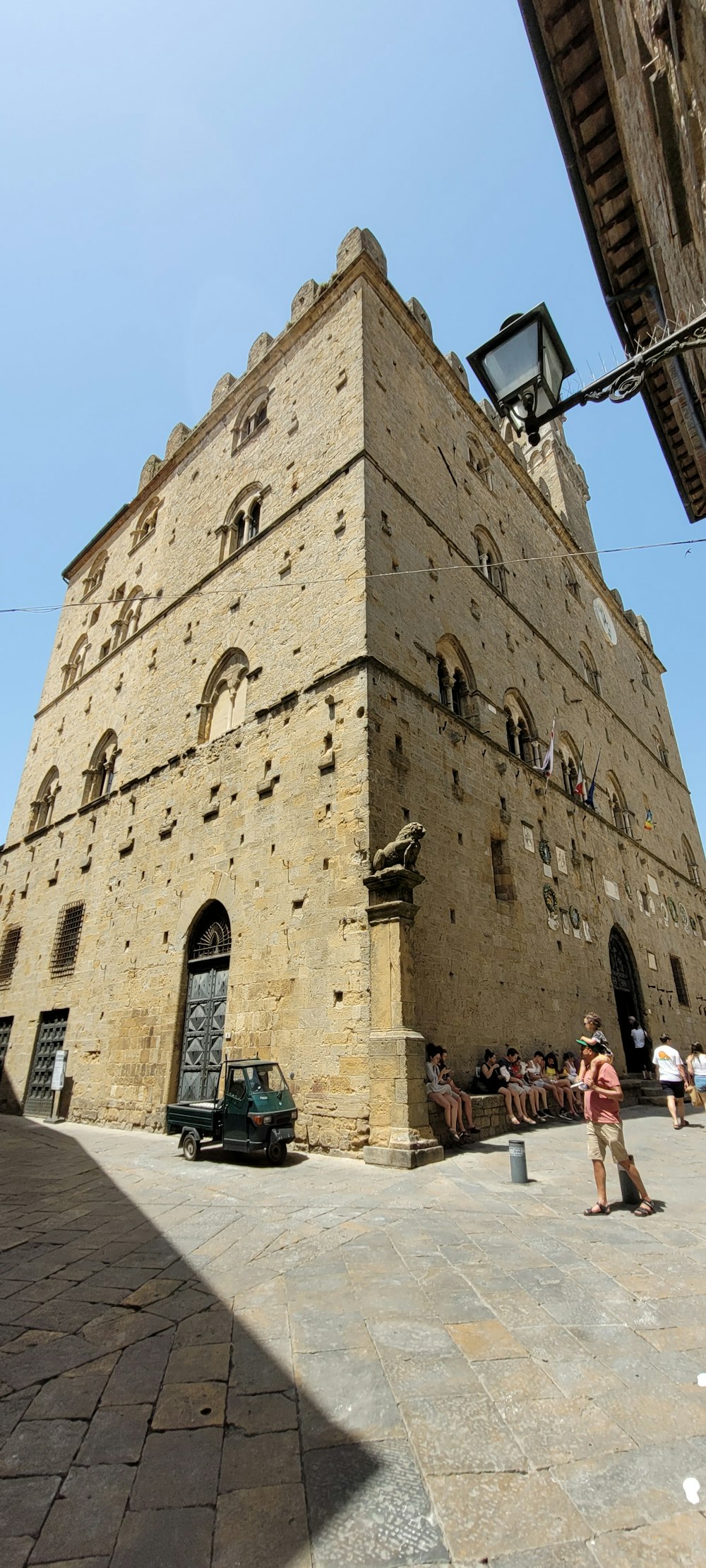 a stone building with a car parked in front of it