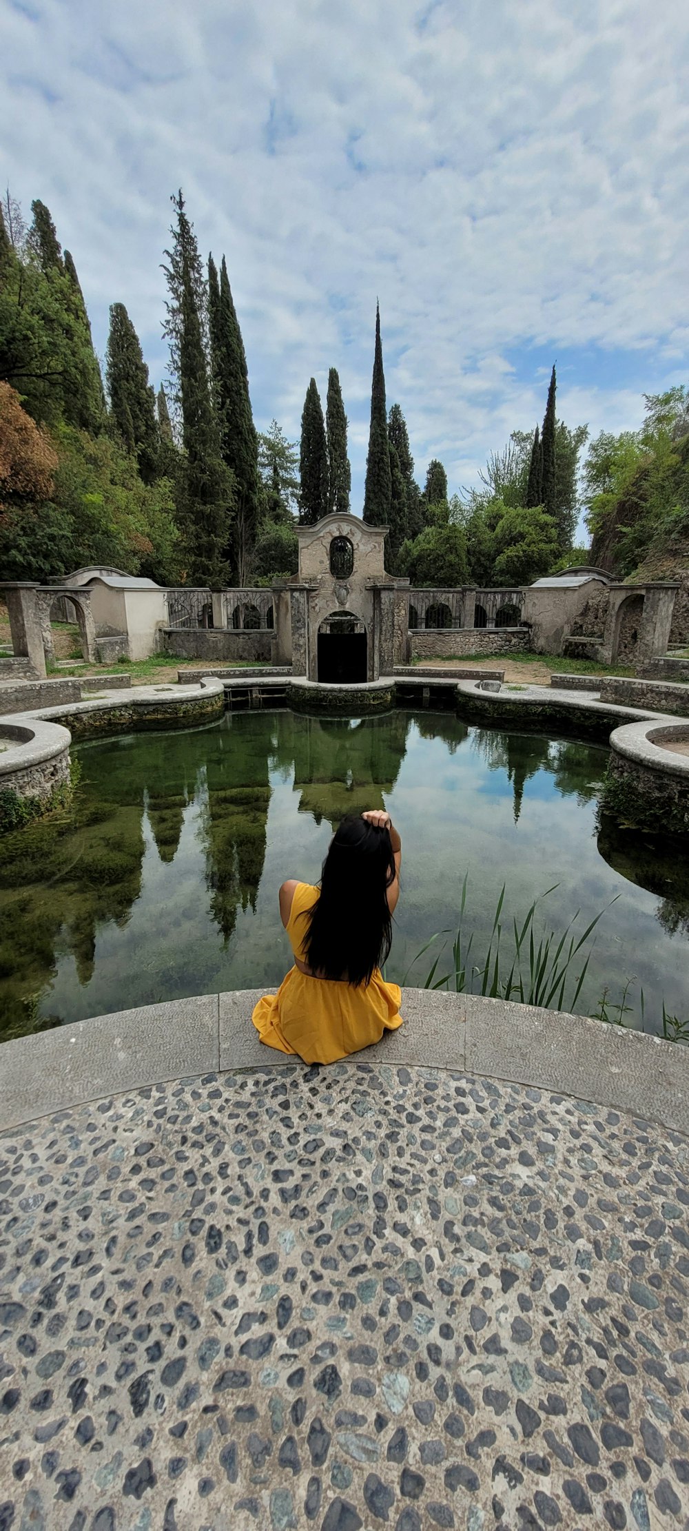 a person sitting in a pool