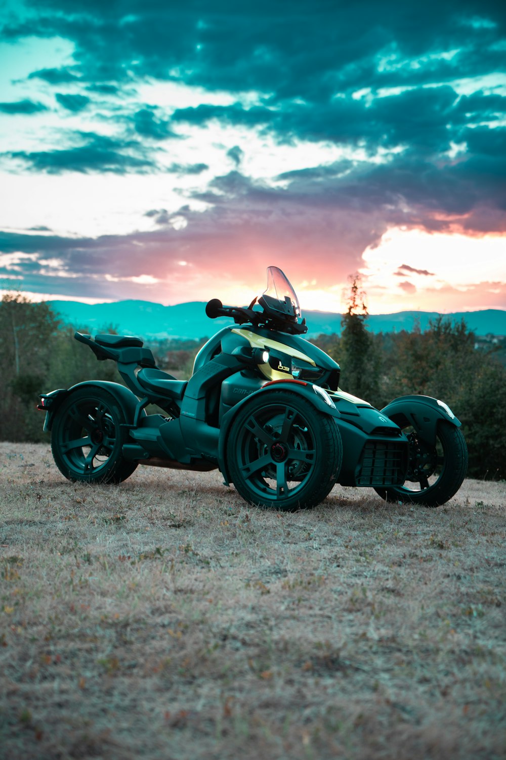 a motorcycle parked on a dirt road