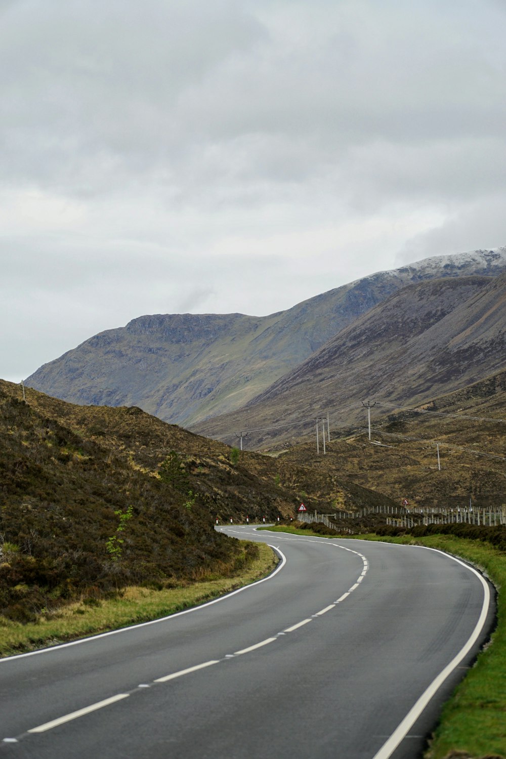 a road with hills on either side