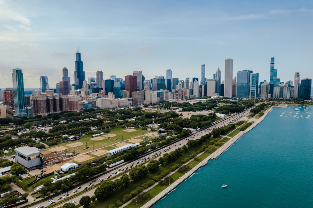 a city skyline with a body of water in front of it