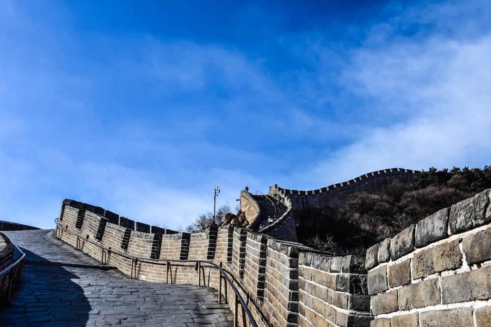 a stone wall with a stone walkway