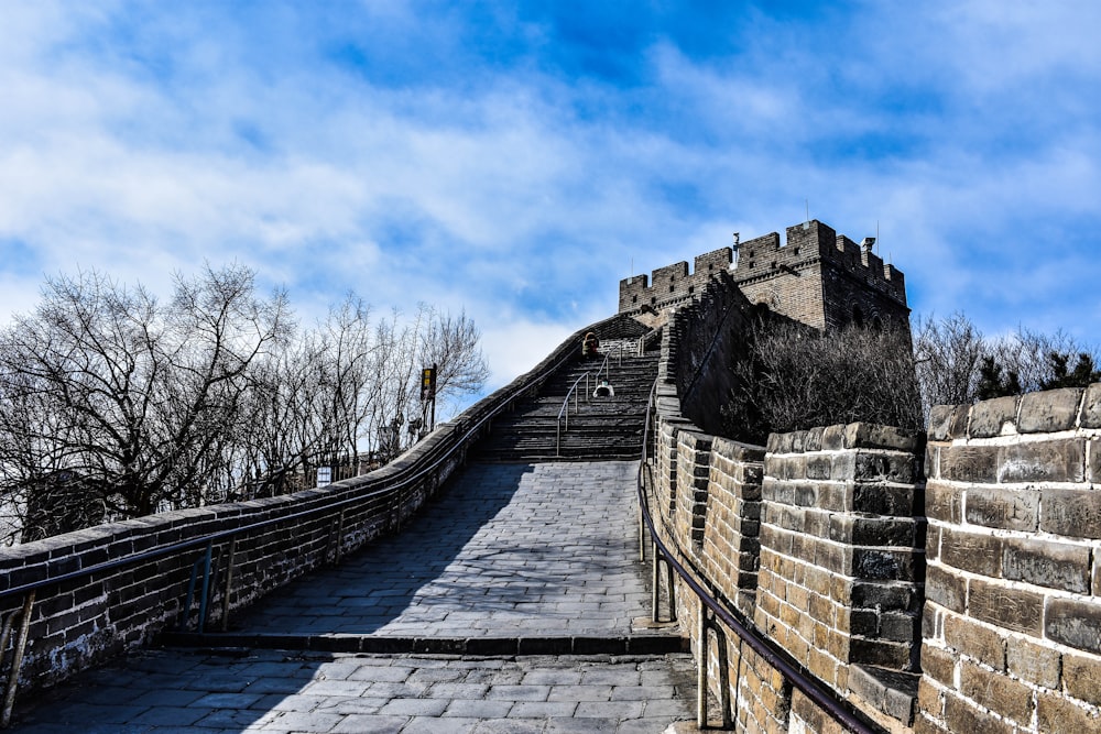 a stone wall with a stone staircase