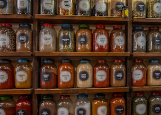 a shelf with many jars of food on it