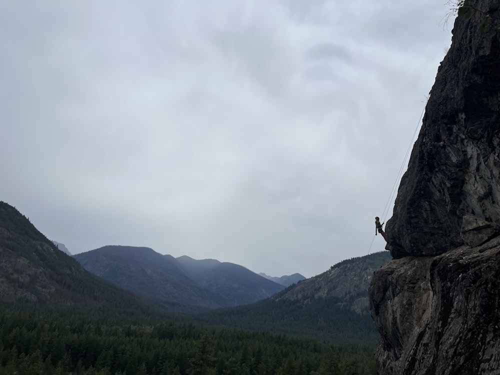 a person climbing a rock