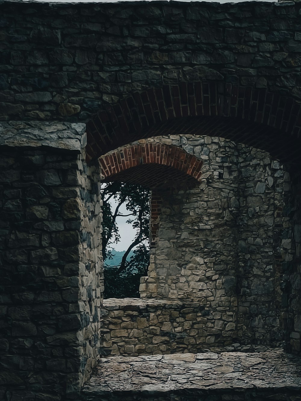 a stone archway with a window