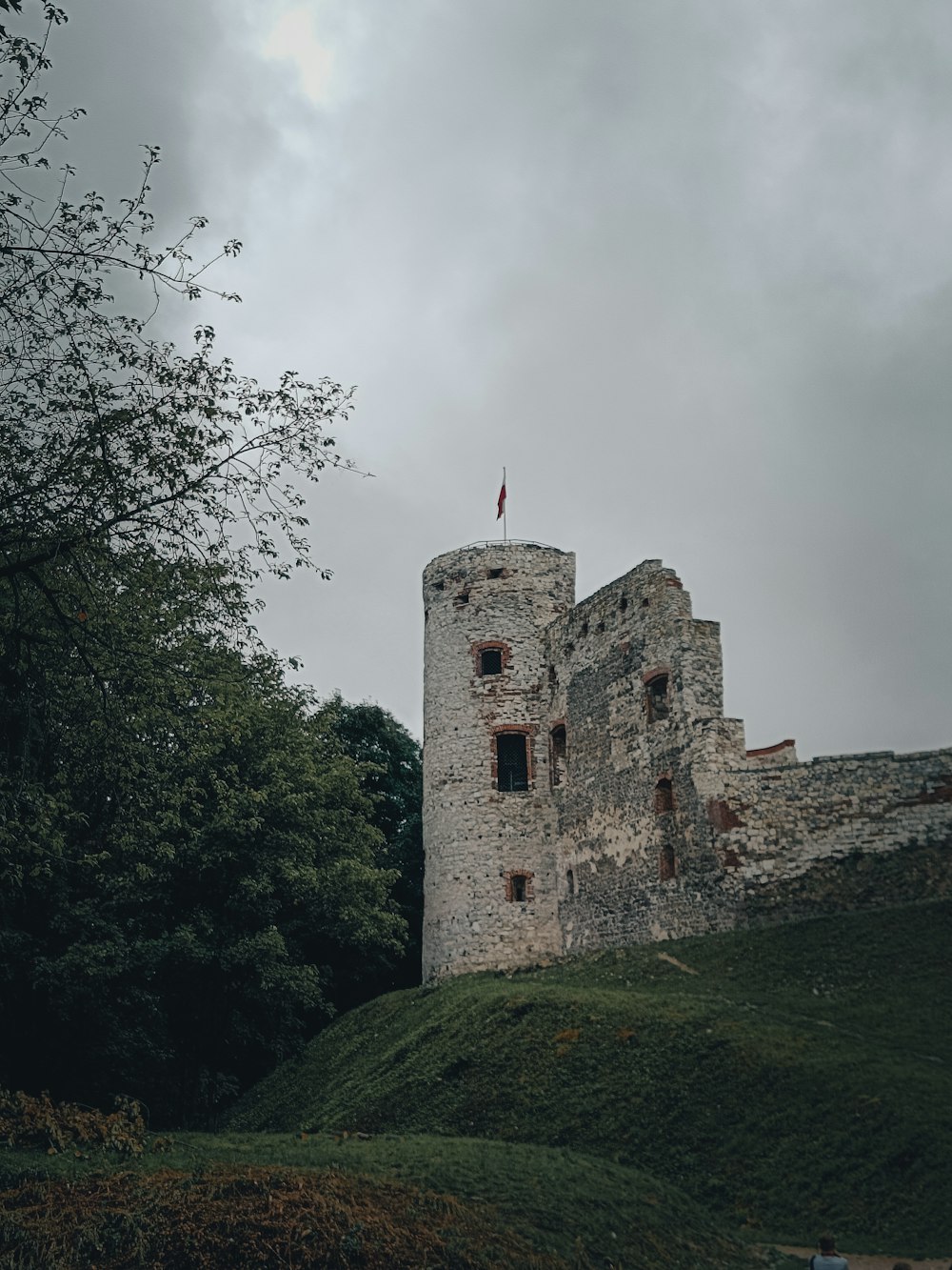 a stone castle on a hill