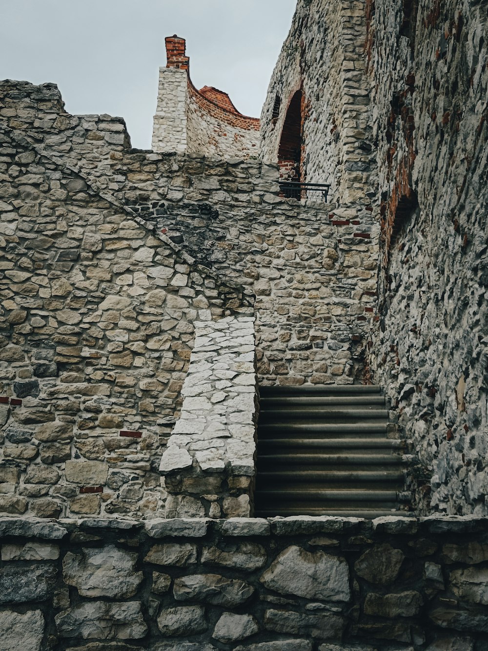 a stone staircase leading up to a stone building